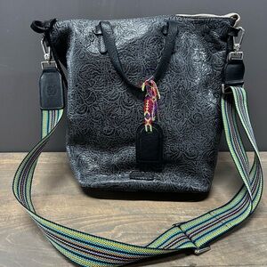 Consuela Steely Sling Black Tooled with Woven Crossbody Strap Women’s Bag
